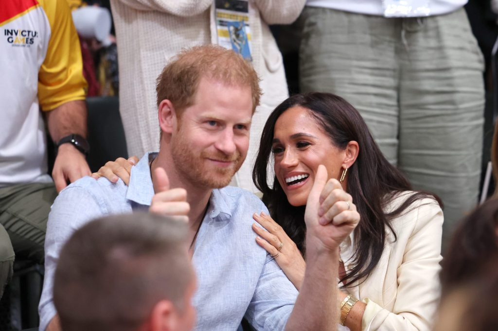 Harry's wife, Meghan Markle, beamed from ear to ear during a volleyball game between host country Germany and Poland.