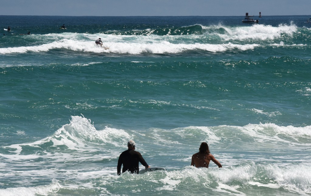 Surfers are seen at Lighthouse Point Park as Hurricane Lee brings strong surf and dangerous rip currents to the Central Florida coast on September 14, 2023.
