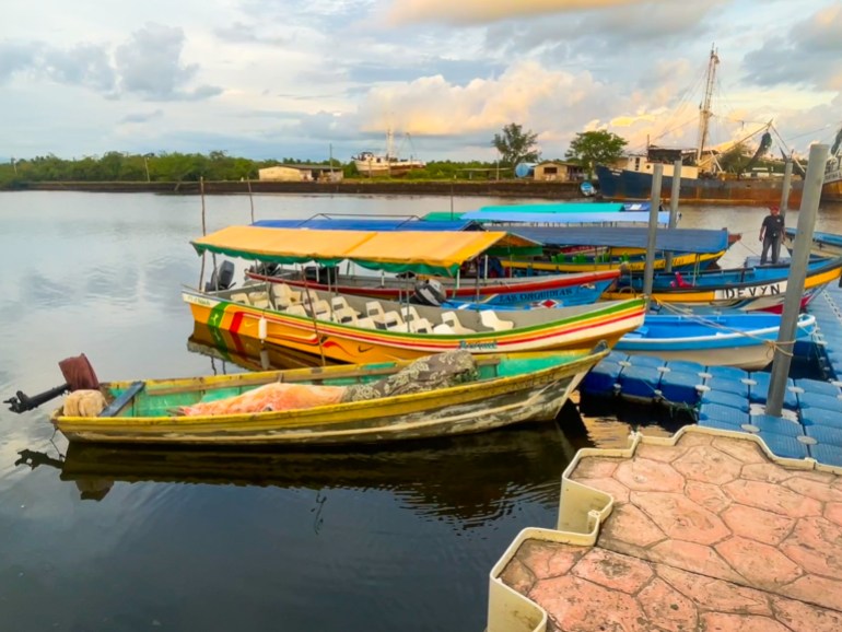 Colorful wooden boats are parked at a dock in Puerto el Triunfo, El Salvador.